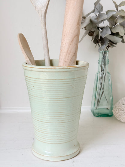 1960s Burton Ware ribbed stoneware pot in sage green, photographed on a white surface