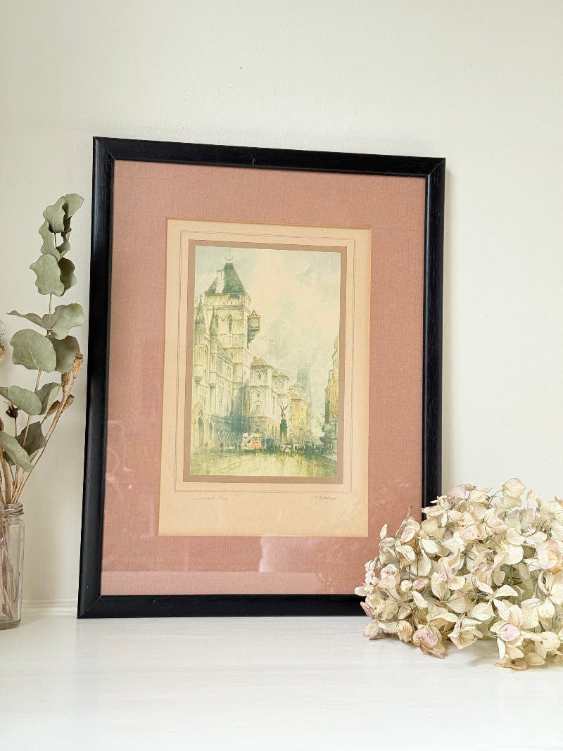 vintage framed print of temple bar watercolour by f robson in black frame with apricot and dusky pink mount on white surface