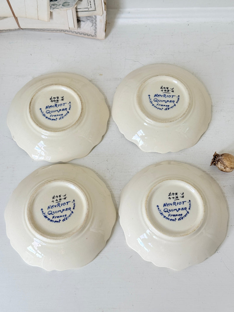 Set of 4 vintage Henriot Quimper faience plates with hand painted shell motifs, scalloped edges and black ground decoration