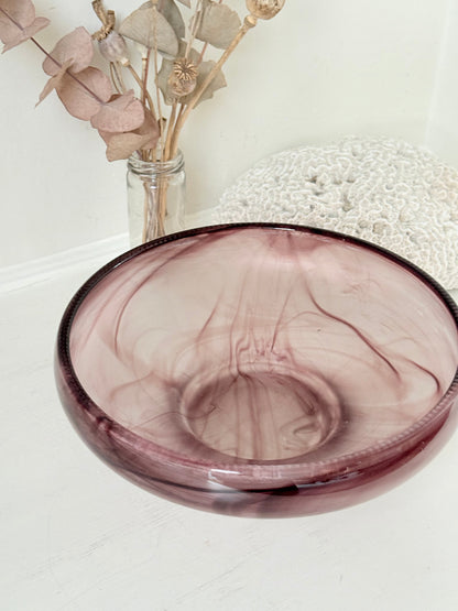Vintage Davidson cloud glass bowl in mauve pink swirl photographed on a white surface