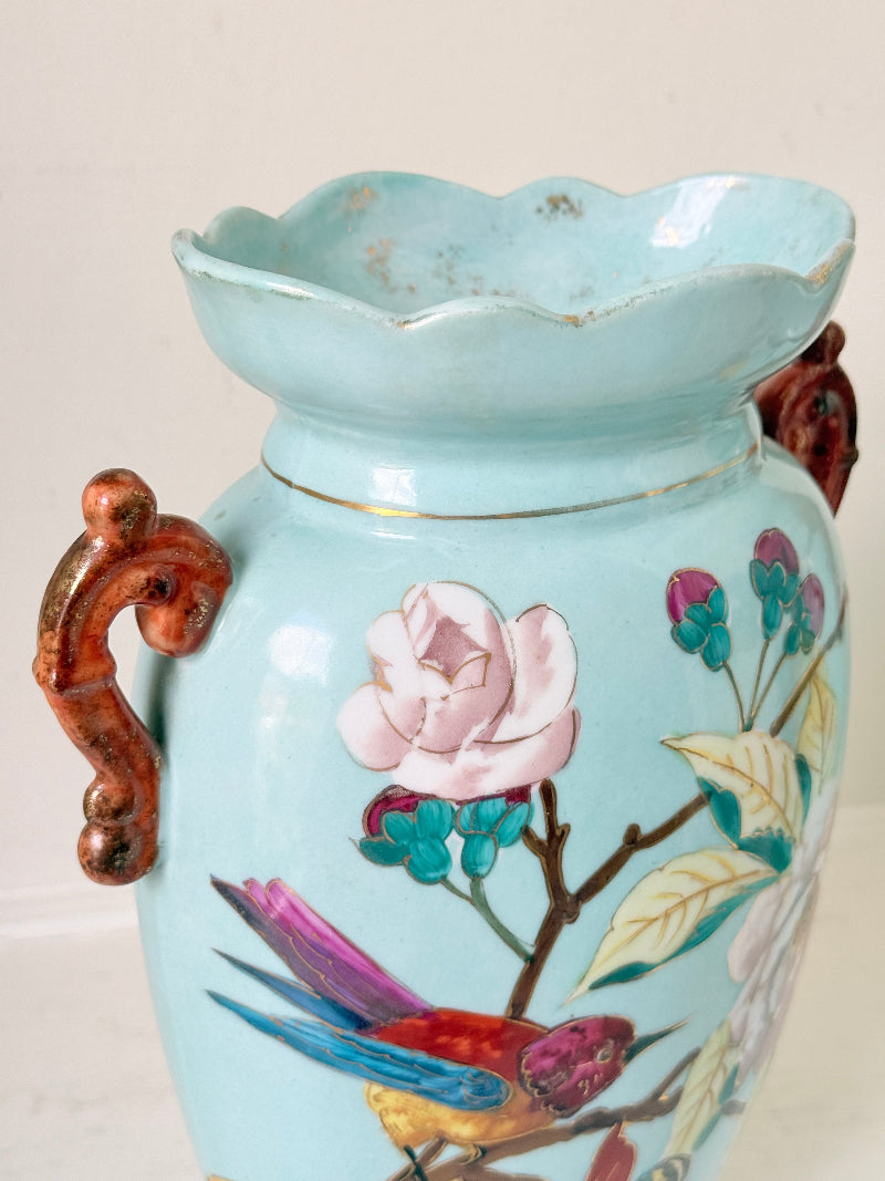 Pair of Paris porcelain Aesthetic Movement vases from the late 1800s, hand painted with birds, blossom and coral handles