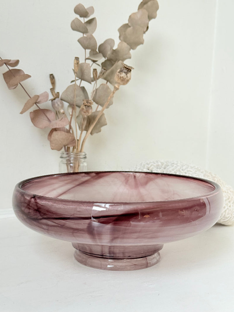Vintage Davidson cloud glass bowl in mauve pink swirl photographed on a white surface