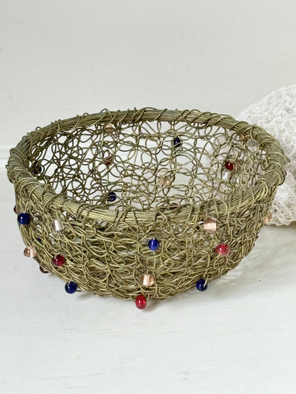 Vintage brass wire basket with coloured glass beads, photographed from multiple angles on a white surface