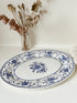 Vintage Johnson Brothers Indies blue and white oval serving platter photographed on a white surface