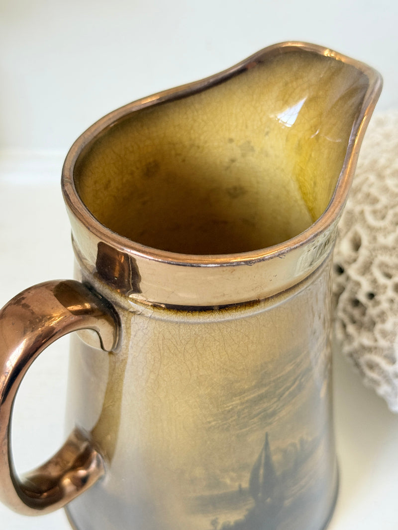 Vintage Ridgways Royal Vistas Ware ceramic jug in brown tones with scenic transfer print, photographed on a white surface