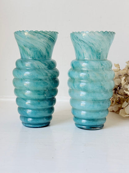 Pair of vintage aqua blue glass vases with beehive pattern and scalloped edges, photographed on a white surface