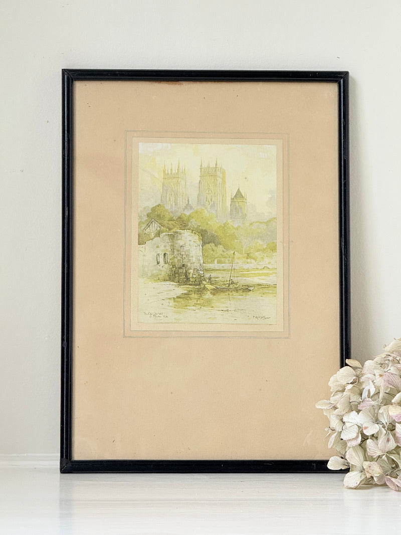 framed print of york minster and city walls in black frame, photographed on white surface