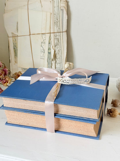 Pair of vintage Amateur Photographer books in blue cloth binding with gilt lettering tied with pale pink ribbon for shelf styling