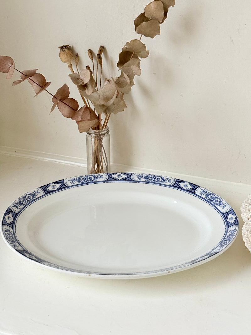 Vintage Burleigh Ware blue and white oval serving platter photographed on a white surface