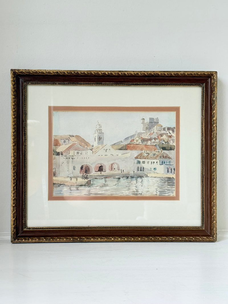 Framed watercolour painting of Dubrovnik harbour and old town architecture, photographed on a white surface