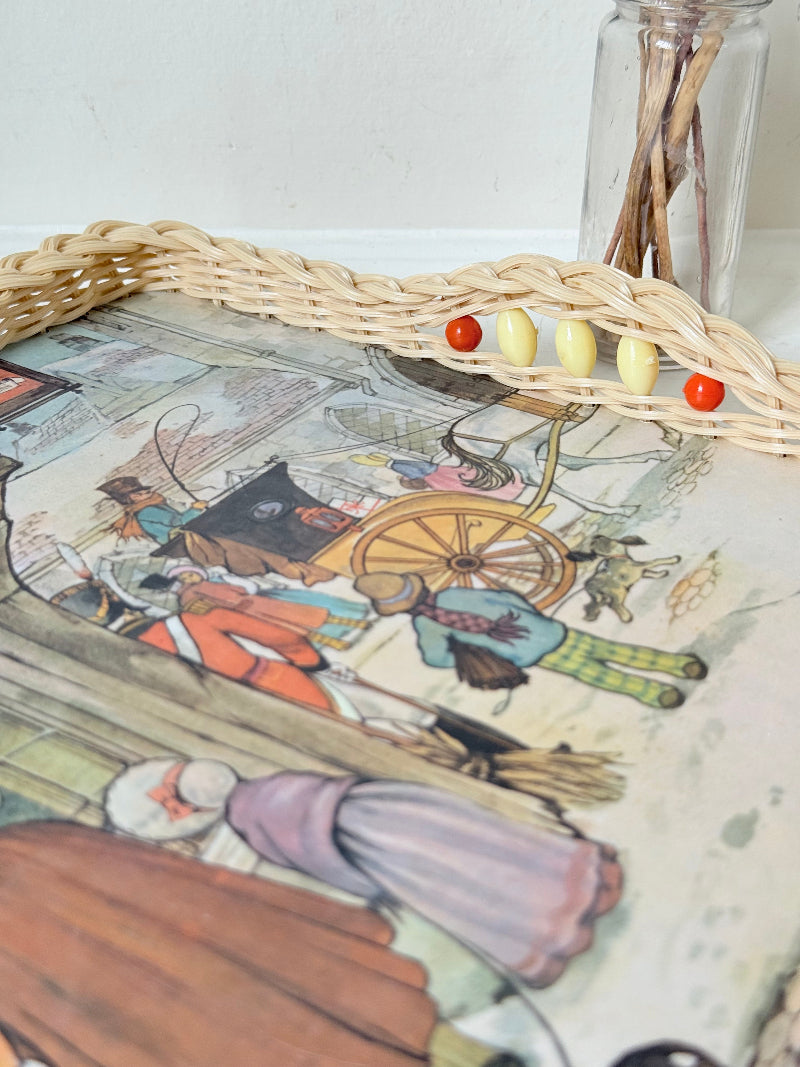 Vintage melamine tray with wicker effect edge and Victorian street scene, photographed on a white surface