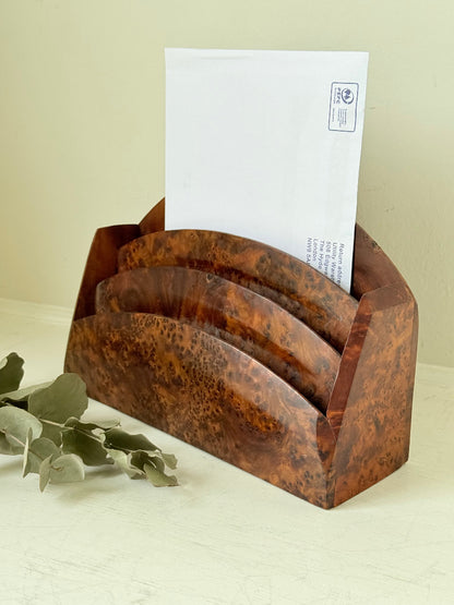 Three-slot curved letter rack made from polished burl wood with rich swirling grain, mid-century style desk organiser.