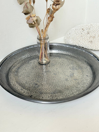 Vintage Harrods pewter drinks tray with hammered surface photographed on a white background.