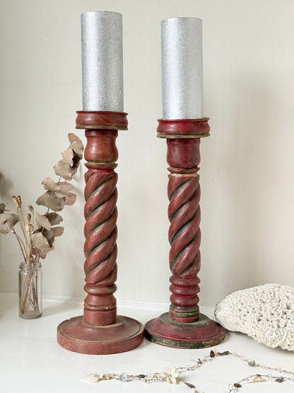 Vintage wooden barley twist candlesticks, a pair with painted finish, photographed on a white surface