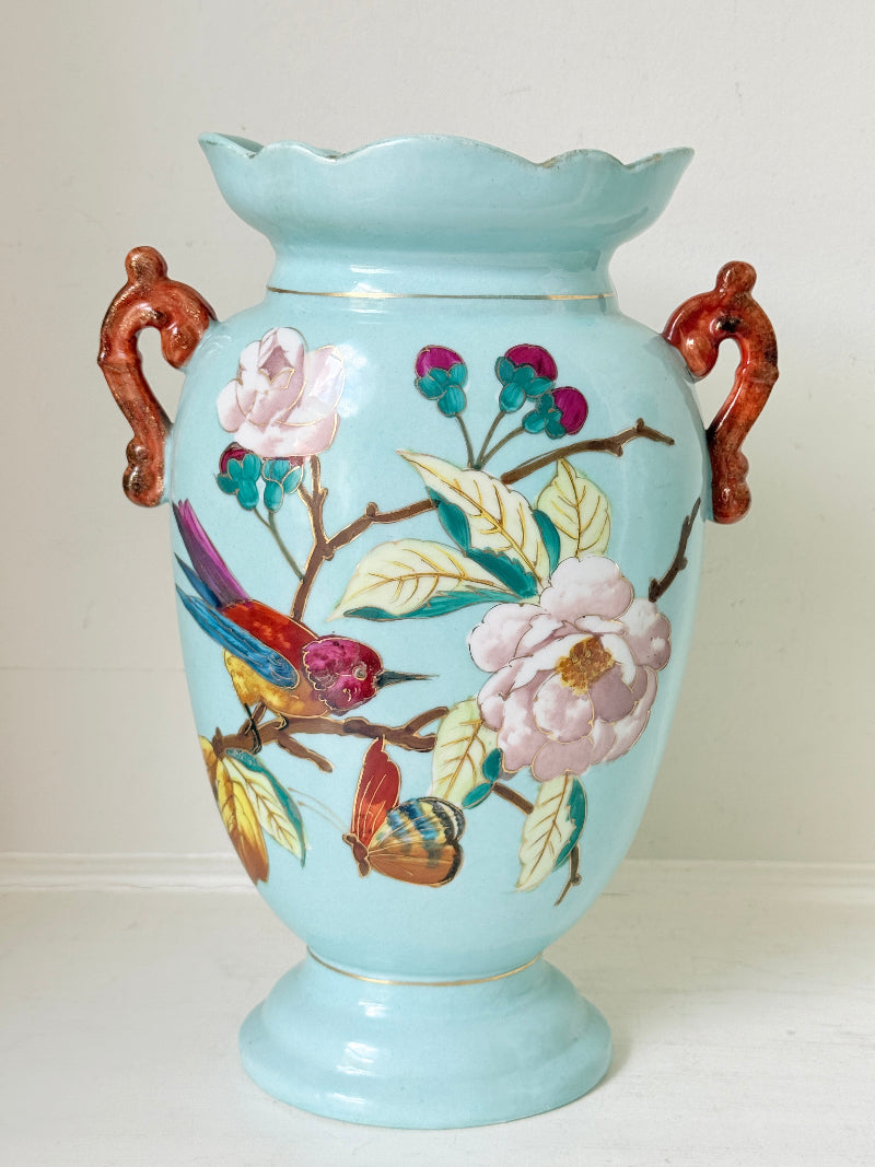 Pair of Paris porcelain Aesthetic Movement vases from the late 1800s, hand painted with birds, blossom and coral handles