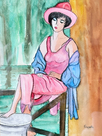 Vintage bright watercolour portrait of a seated woman in pink hat and dress with blue jacket, framed in blue wood with off-white mount, photographed on a white surface.