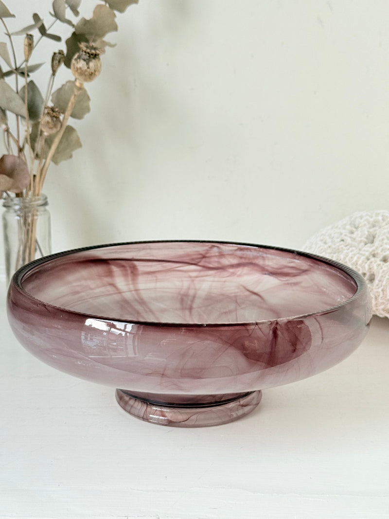 Vintage Davidson cloud glass bowl in mauve pink swirl photographed on a white surface