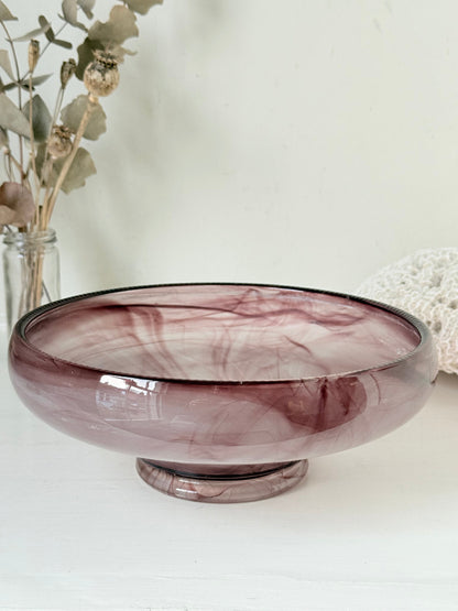 Vintage Davidson cloud glass bowl in mauve pink swirl photographed on a white surface
