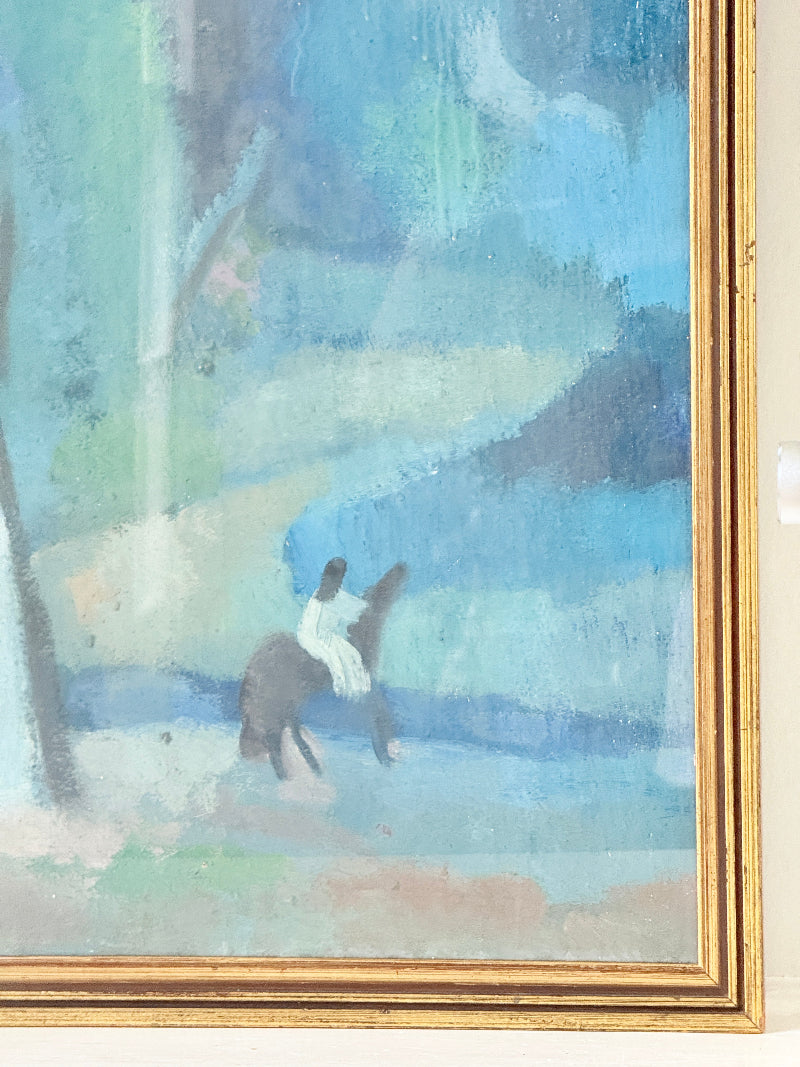 A framed painting featuring an abstract landscape in shades of blue, green, and white, with a small dark horse and rider motif near the bottom center. The artwork is enclosed in a gold-toned frame and photographed against a light neutral wall.