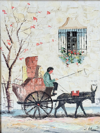 Vintage framed oil painting of horse and cart scene signed L. Cabanes photographed on a white surface
