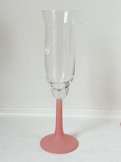 Set of five 1980s frosted pink tulip champagne flutes from the Candlelight range, photographed on a white surface