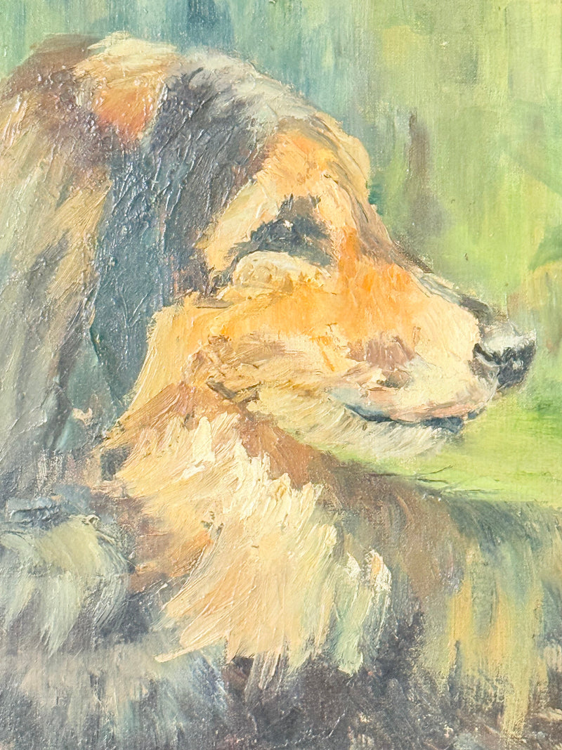 Oil painting of a dog by Muriel Hester Broughton in wooden frame, photographed on white surface.