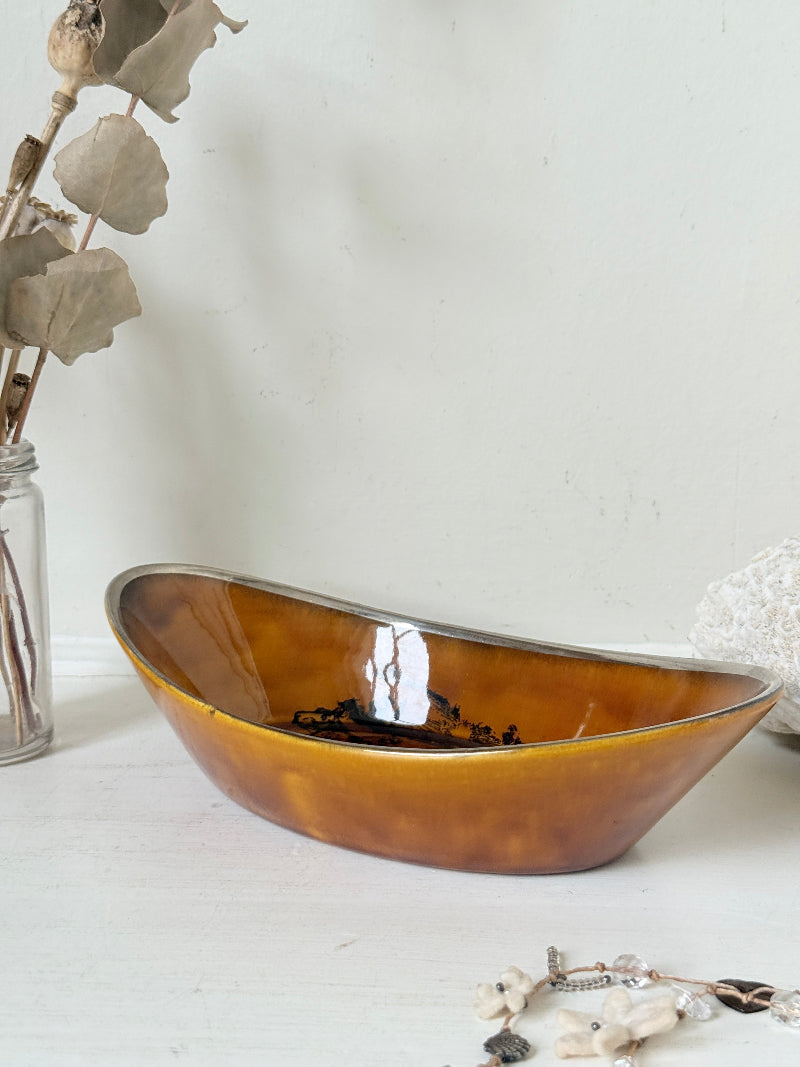 Antique Ridgways stoneware oval dish photographed on a white surface in amber treacle glaze with black Coaching Days and Coaching Ways transfer scene