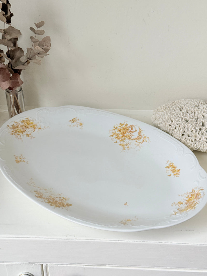 Antique Springer and Co Elbogen Senta porcelain platter in white with floral detail, photographed on a white surface