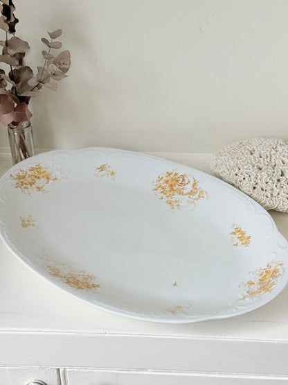 Antique Springer and Co Elbogen Senta porcelain platter in white with floral detail, photographed on a white surface