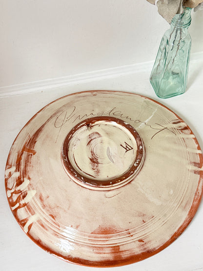 Mid century Puigdemont La Bisbal charger with hand painted fish in blue and white on orange glaze