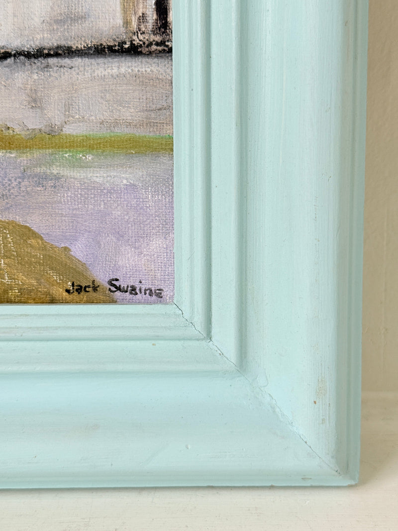Close-up of a framed painting corner showing a light aqua painted frame and part of the artwork with soft lavender, green, and tan brushstrokes. The signature &