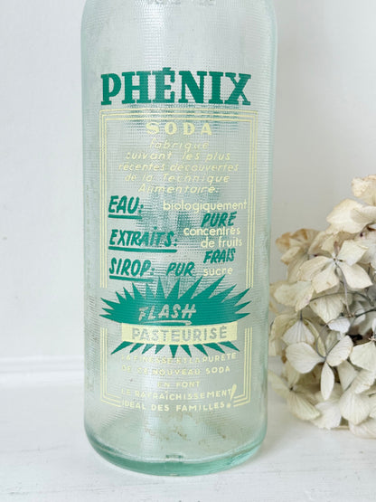 vintage french soda bottle phenix aqua green glass with ceramic swing top 31cm on white surface