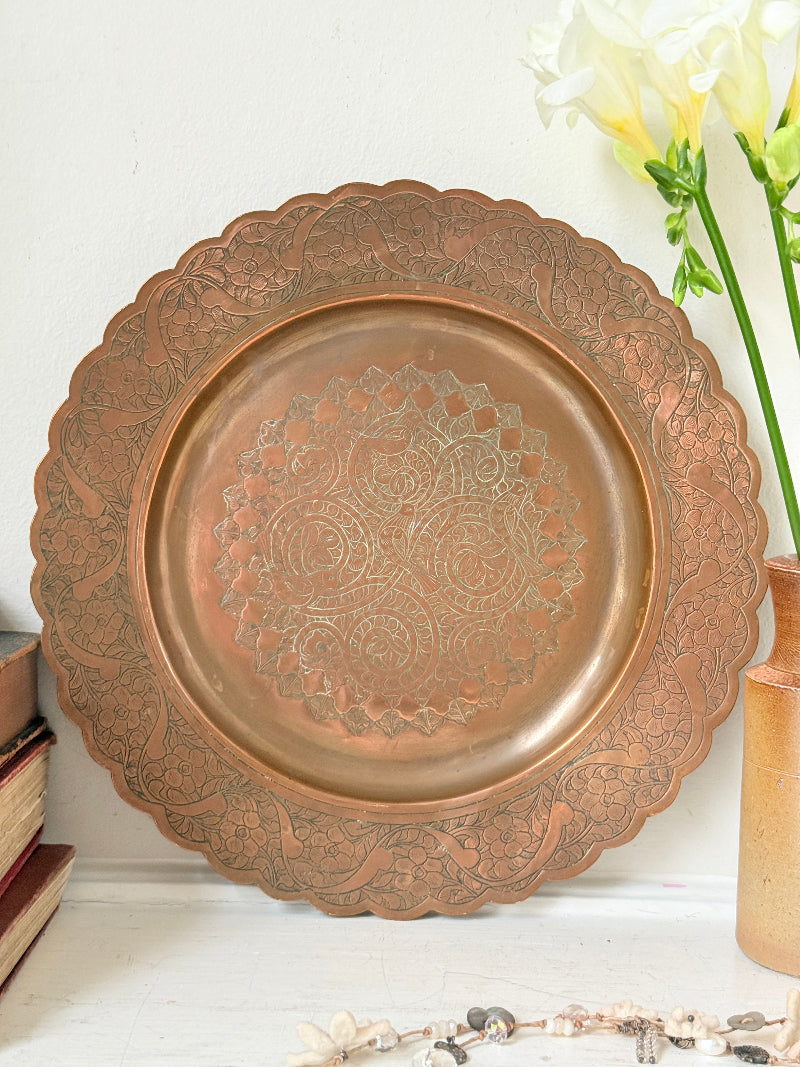 Vintage hand engraved copper tray with scalloped edge, bird and floral motif and warm aged patina for boho interiors