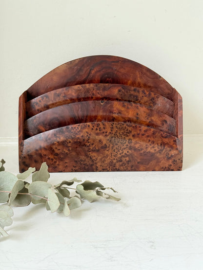 Three-slot curved letter rack made from polished burl wood with rich swirling grain, mid-century style desk organiser.