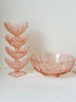 Art Deco pink pressed glass dessert service with scalloped serving bowl and four footed sundae dishes