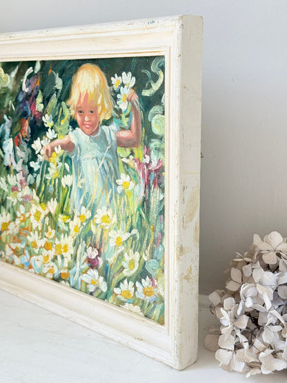 Oil painting after Dorothea Sharp of a young girl picking white flowers in a meadow, distressed white wood frame