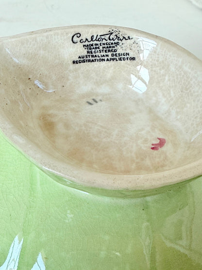 Vintage Carlton Ware green leaf pedestal dish with pansy decoration, photographed on a white surface