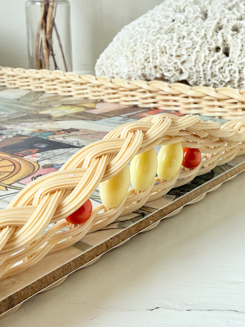 Vintage melamine tray with wicker effect edge and Victorian street scene, photographed on a white surface