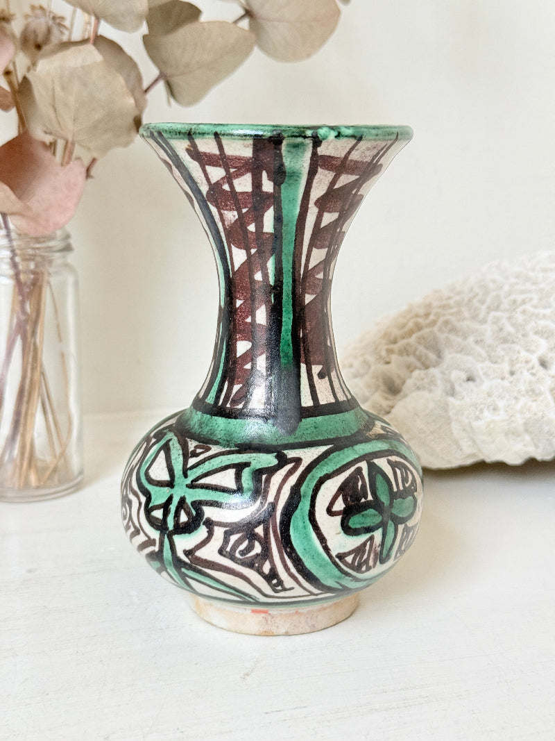 Domingo Punter Teruel studio pottery vase in green and black glaze photographed on a white surface