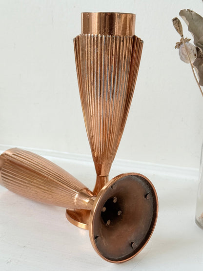 Pair of vintage copper Art Deco vases with fluted surface, photographed on a white background.