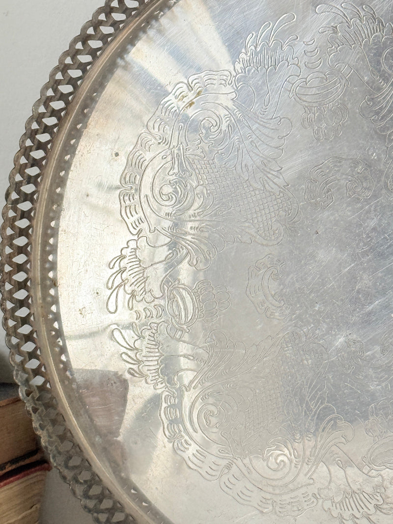 Vintage round silver plated gallery tray with pierced rim, engraved centre and aged patina for drinks or vanity styling