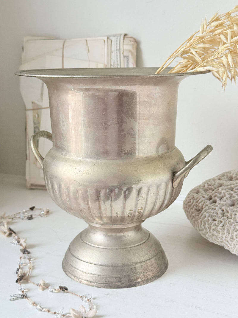 Vintage silver plate on brass wine cooler in Campana urn form with twin handles, aged patina and gadrooned detail