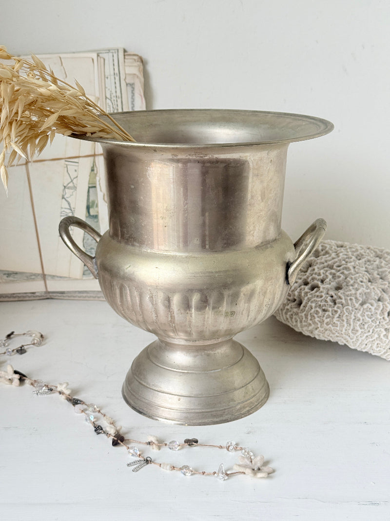 Vintage silver plate on brass wine cooler in Campana urn form with twin handles, aged patina and gadrooned detail