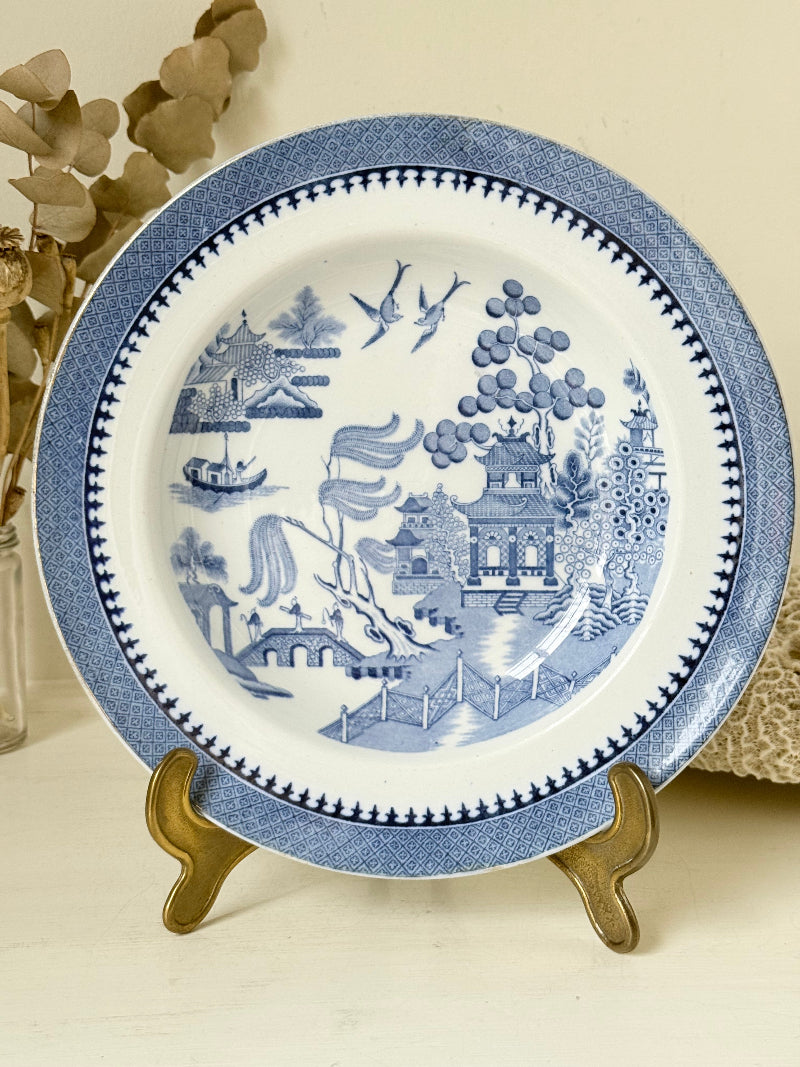 Minton Blue Willow serving dish dated 1928 with blue transfer pattern shown on a white surface.