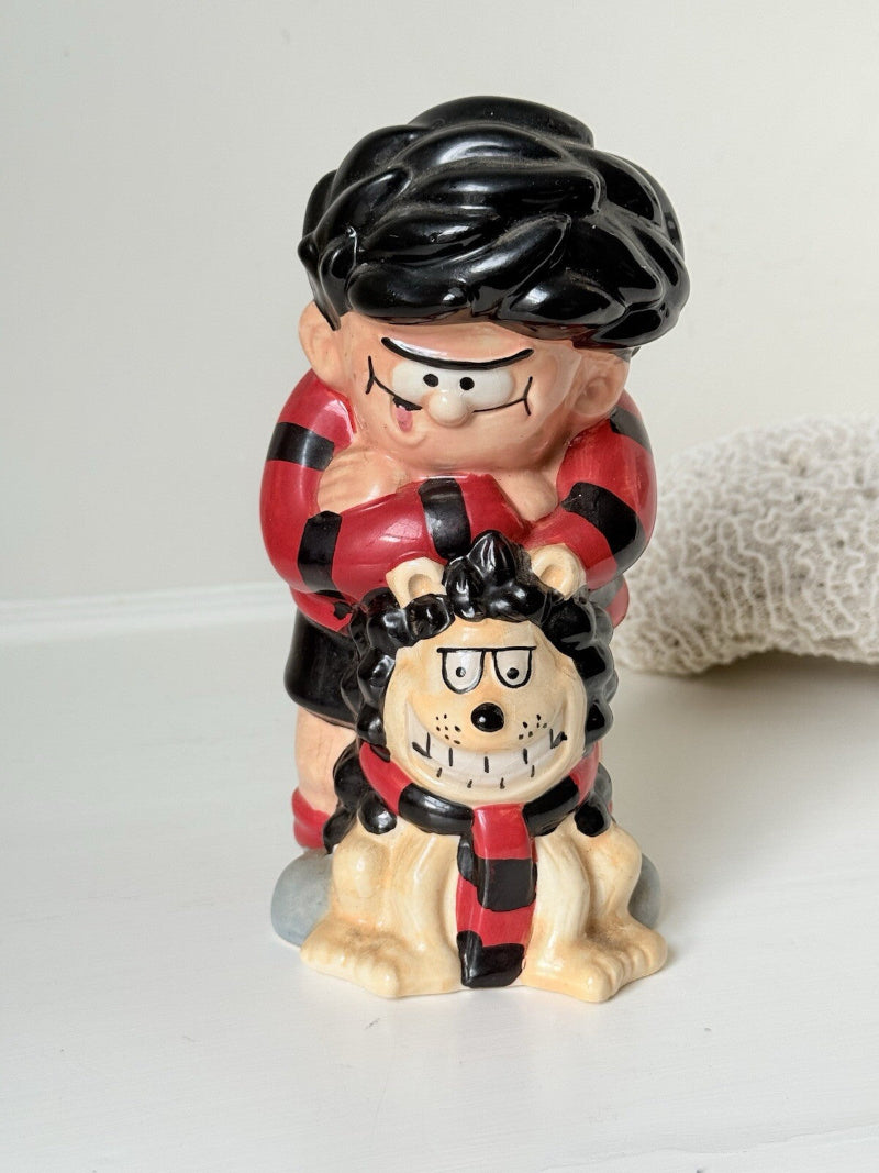 Dennis the Menace and Gnasher ceramic moneybox in red and black comic-style outfits, with vintage hand-painted detail.