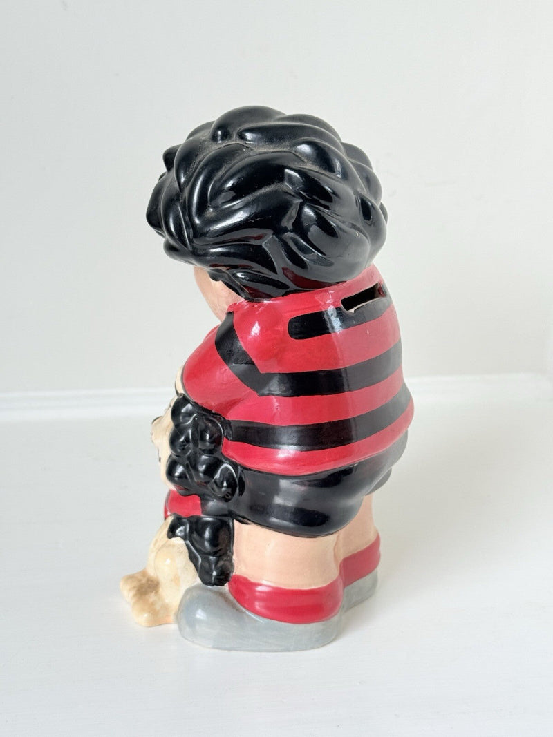 Dennis the Menace and Gnasher ceramic moneybox in red and black comic-style outfits, with vintage hand-painted detail.