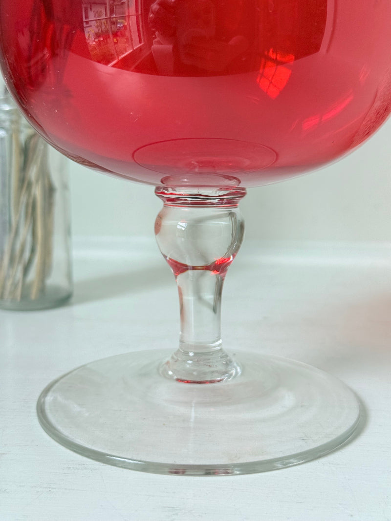 Large retro red glass brandy glass displayed on a white background.