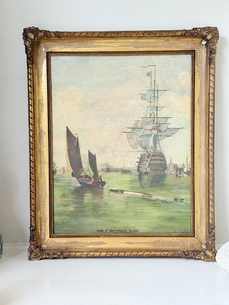 Vintage oil painting of man o’ war sailing ship with fishing boats in gilt frame