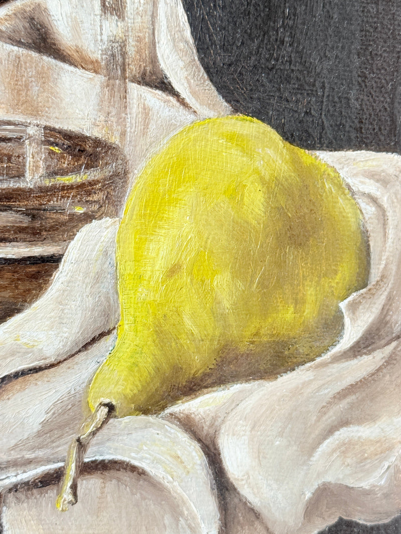 A still life painting of a bright yellow pear resting on draped cream fabric, with a dark gray background and a brown bowl partially visible on the left.