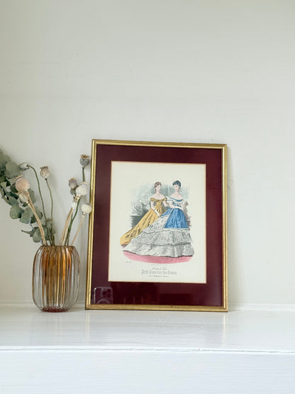 Vintage Modes de Paris fashion plate with gilt frame and burgundy mount, photographed on white surface
